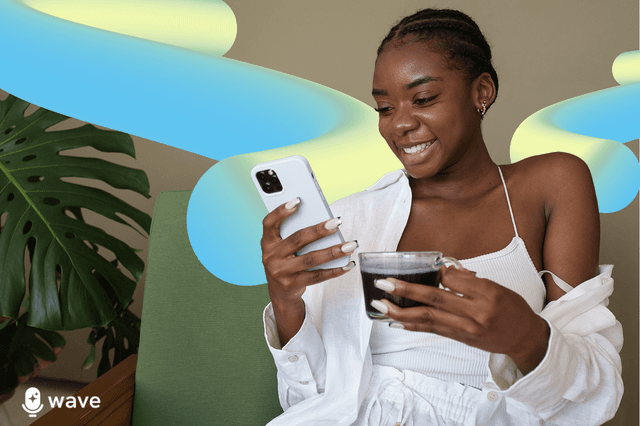 Woman drinking coffee using her cellphone