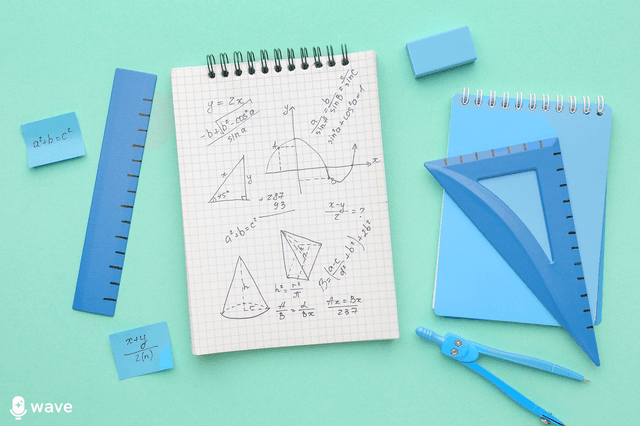 A notpad covered in equations on a blue desk surrounded by a blue geometry set