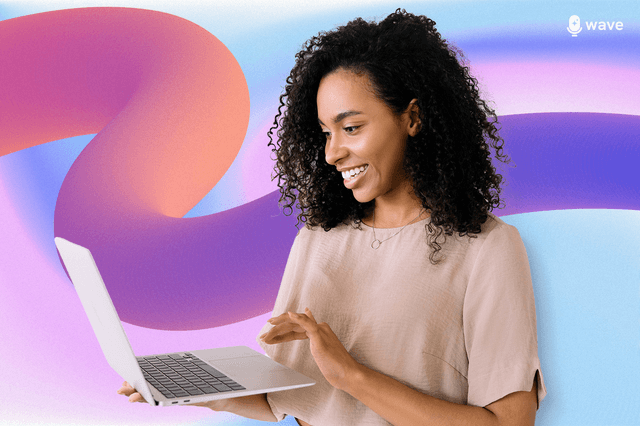 A woman smiling at her laptop