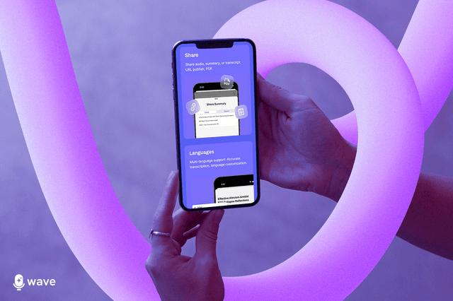 A tablet with a stylus pen is placed on a table beside a computer keyboard for taking notes